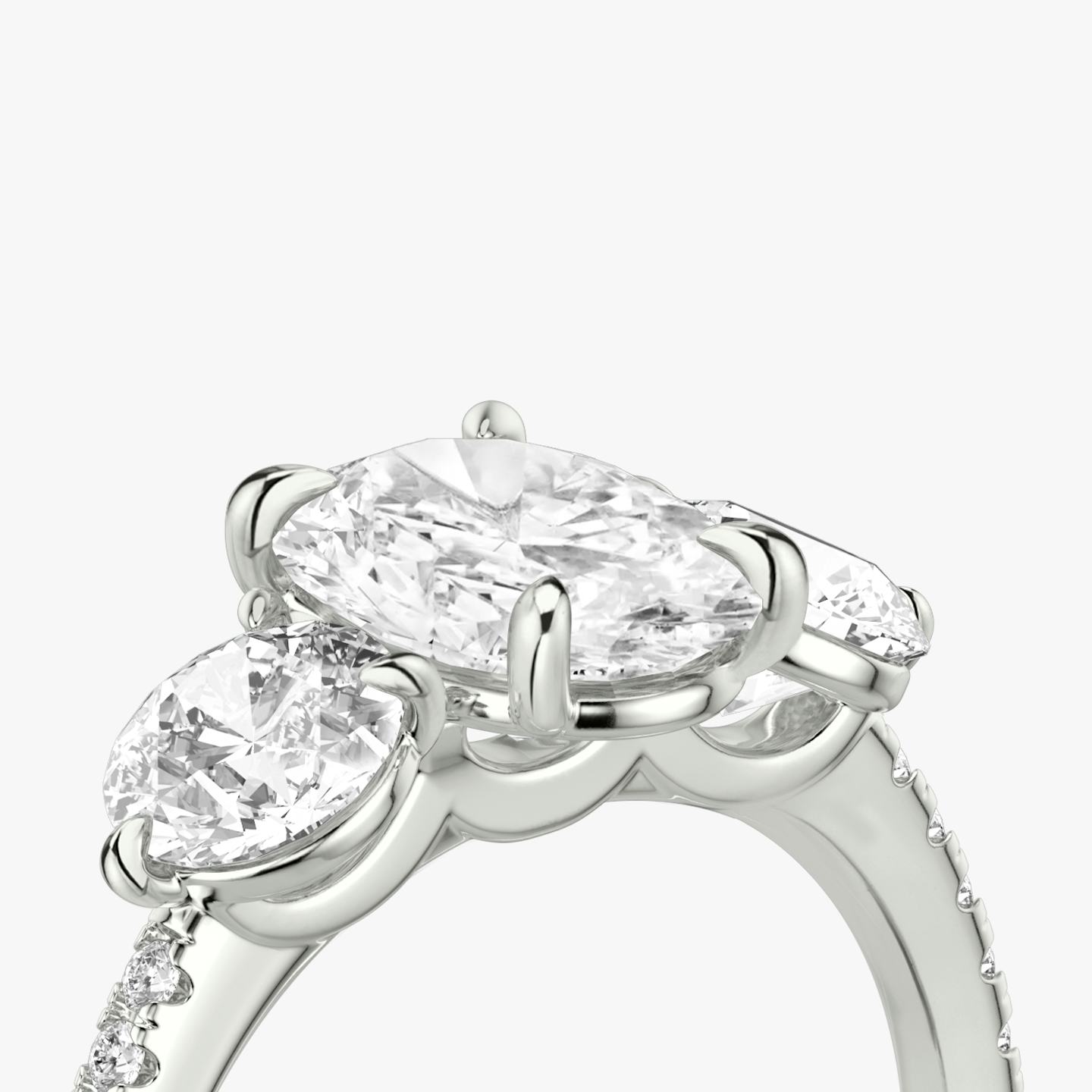 The Three Stone | Oval | Platinum | Band: Pavé | Side stone carat: 1/2 | Side stone shape: Round Brilliant | Diamond orientation: vertical | Carat weight: See full inventory