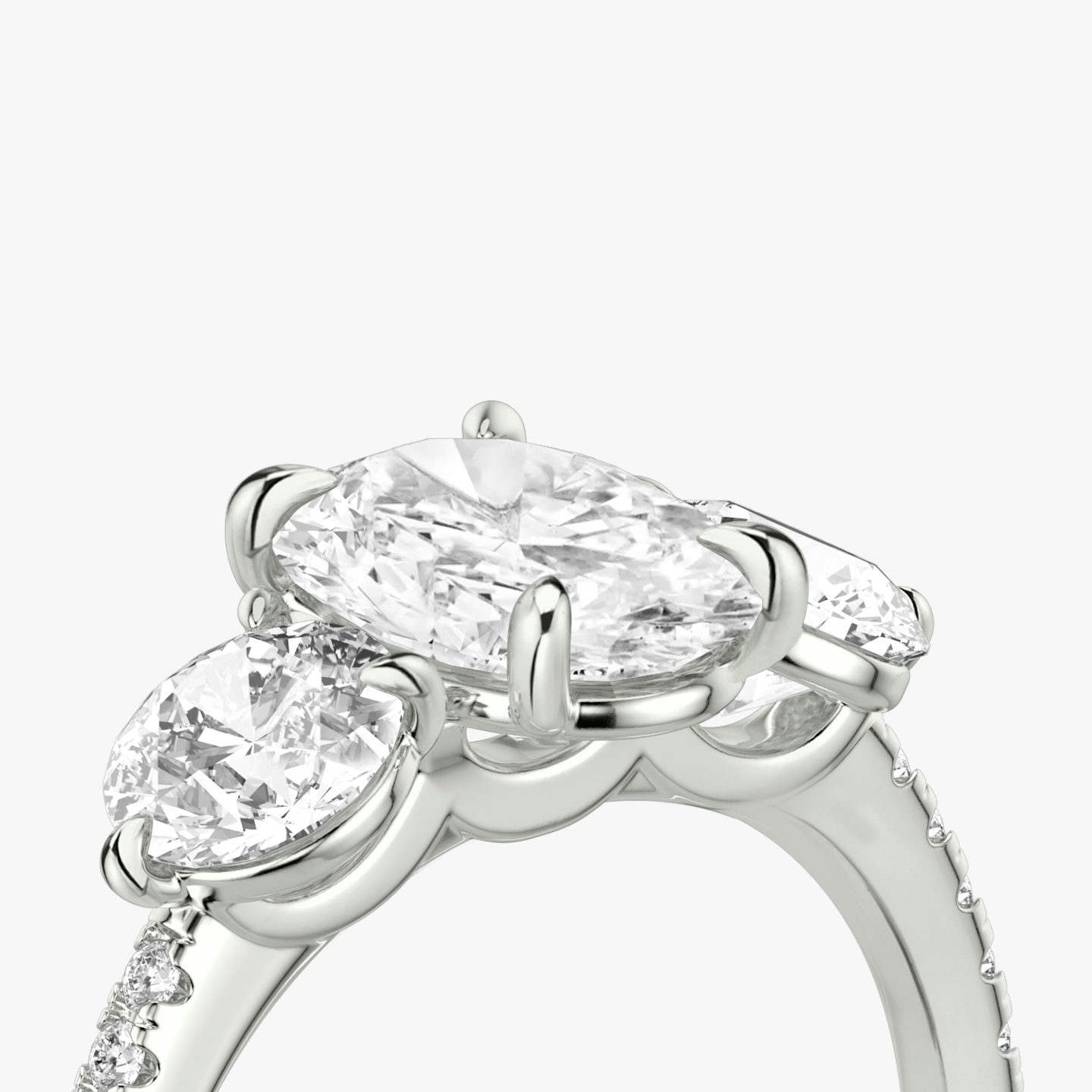 The Three Stone | Oval | 18k | 18k White Gold | Band: Pavé | Side stone carat: 1/2 | Side stone shape: Round Brilliant | Diamond orientation: vertical | Carat weight: See full inventory