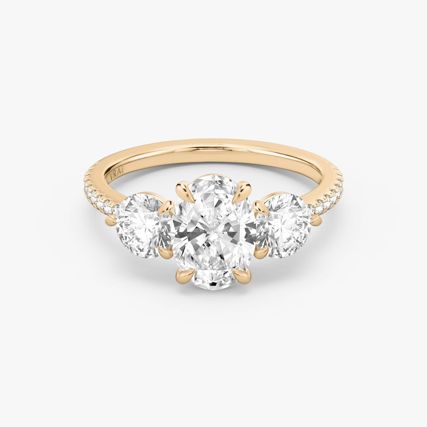 The Three Stone | Oval | 14k | 14k Rose Gold | Band: Pavé | Side stone carat: 1/2 | Side stone shape: Round Brilliant | Diamond orientation: vertical | Carat weight: See full inventory