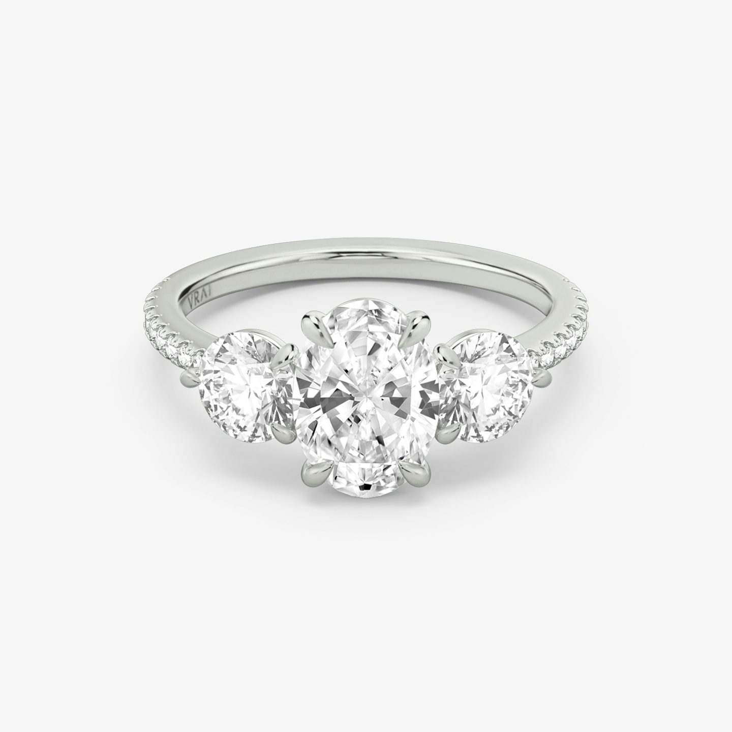 The Three Stone | Oval | 18k | 18k White Gold | Band: Pavé | Side stone carat: 1/2 | Side stone shape: Round Brilliant | Diamond orientation: vertical | Carat weight: See full inventory