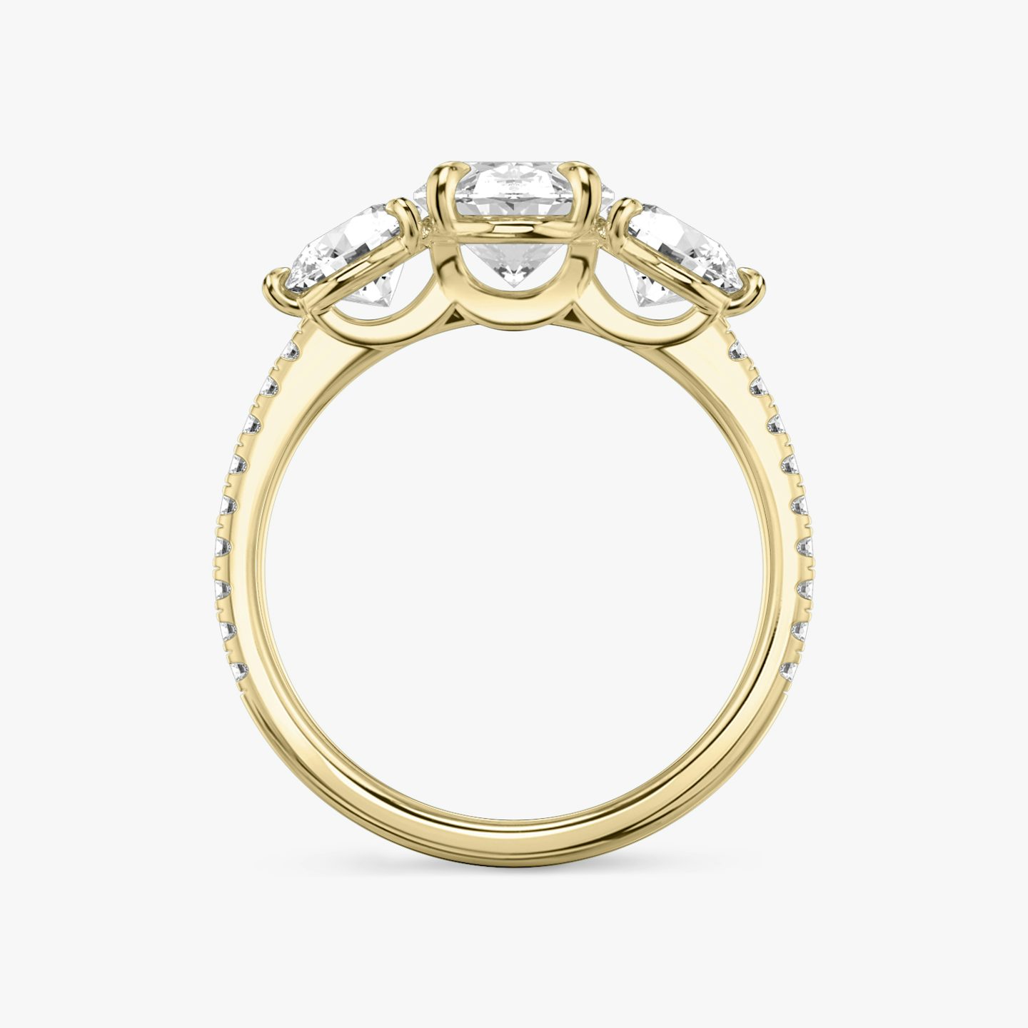 The Three Stone | Oval | 18k | 18k Yellow Gold | Band: Pavé | Side stone carat: 1/2 | Side stone shape: Round Brilliant | Diamond orientation: vertical | Carat weight: See full inventory