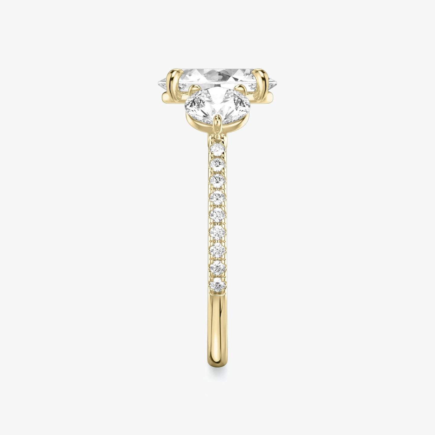 The Three Stone | Oval | 18k | 18k Yellow Gold | Band: Pavé | Side stone carat: 1/2 | Side stone shape: Round Brilliant | Diamond orientation: vertical | Carat weight: See full inventory