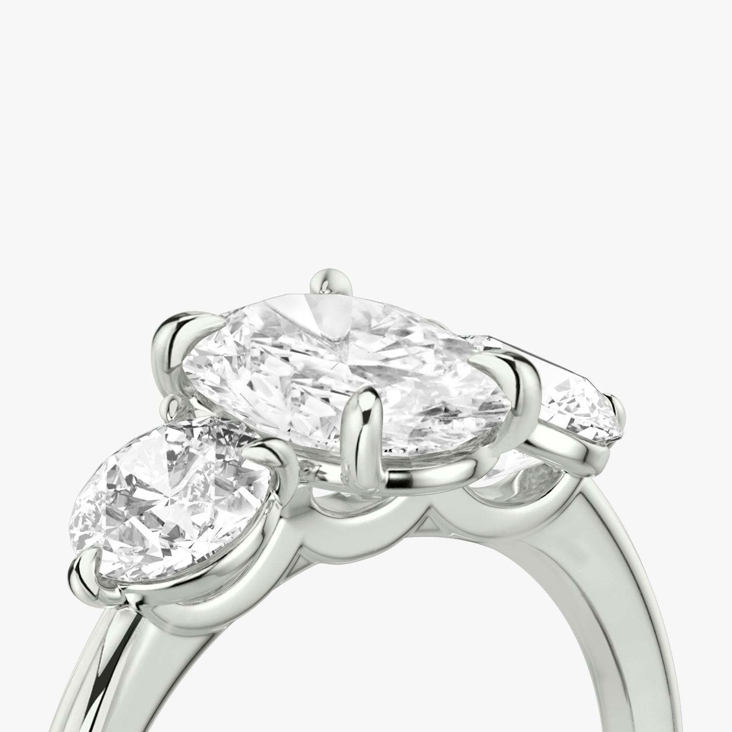 The Three Stone | Oval | Platinum | Band: Plain | Side stone carat: 1/2 | Side stone shape: Round Brilliant | Diamond orientation: vertical | Carat weight: See full inventory