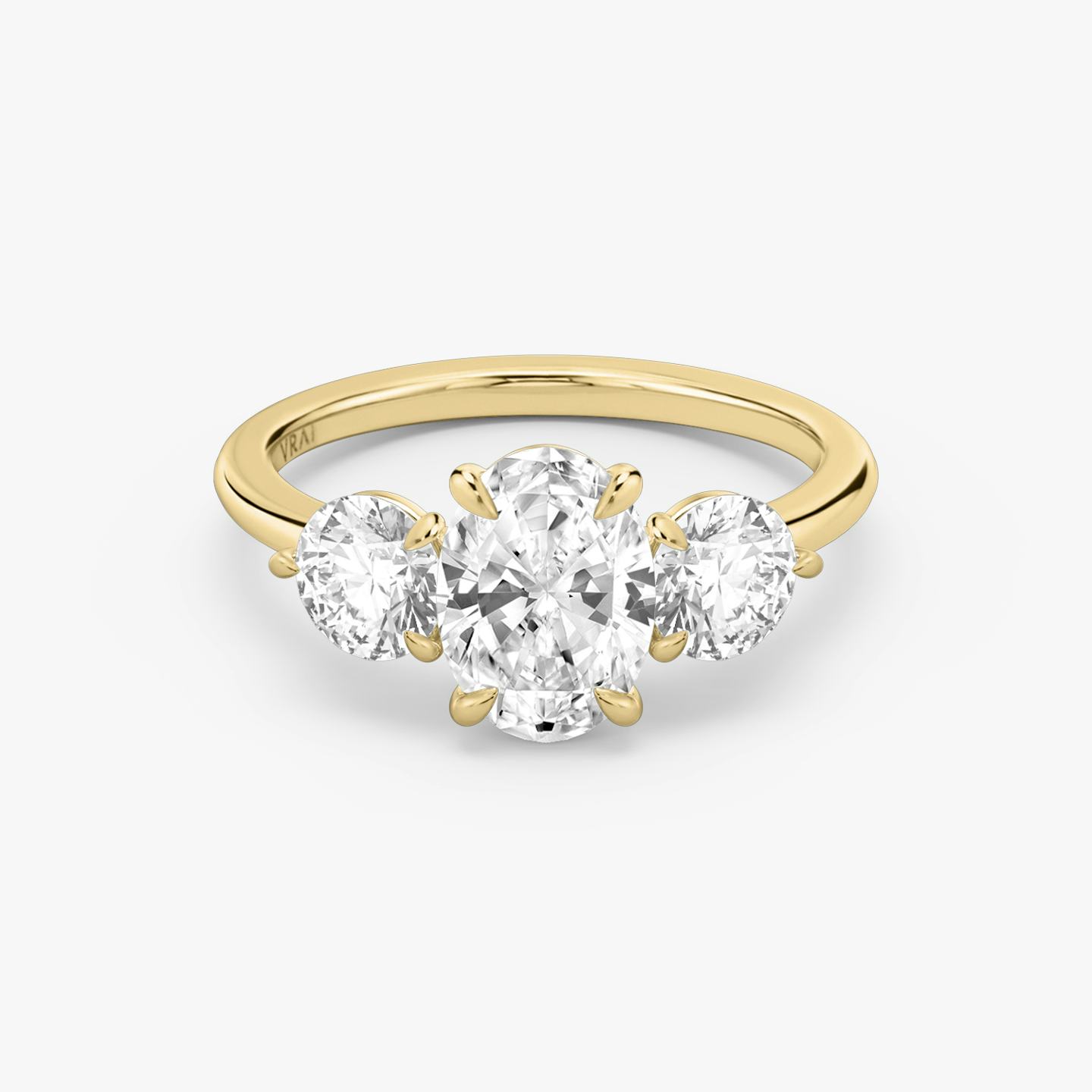 The Three Stone | Oval | 18k | 18k Yellow Gold | Band: Plain | Side stone carat: 1/2 | Side stone shape: Round Brilliant | Diamond orientation: vertical | Carat weight: See full inventory