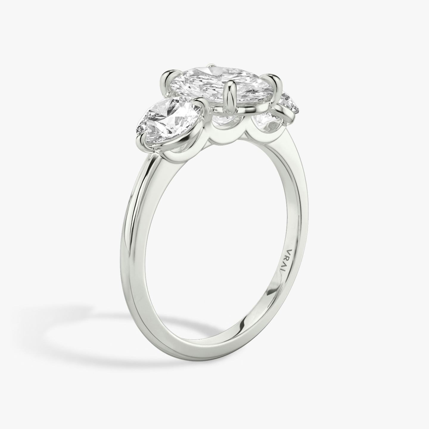 The Three Stone | Oval | Platinum | Band: Plain | Side stone carat: 1/2 | Side stone shape: Round Brilliant | Diamond orientation: vertical | Carat weight: See full inventory