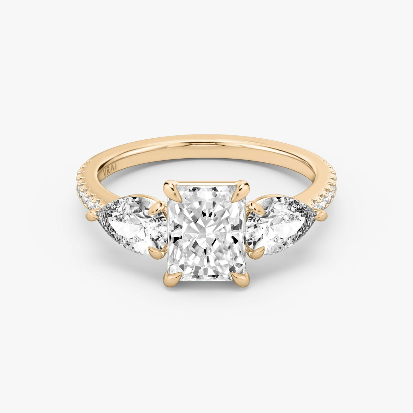 The Three Stone | Radiant | 14k | 14k Rose Gold | Band: Pavé | Side stone carat: 1/2 | Side stone shape: Pear | Diamond orientation: vertical | Carat weight: See full inventory