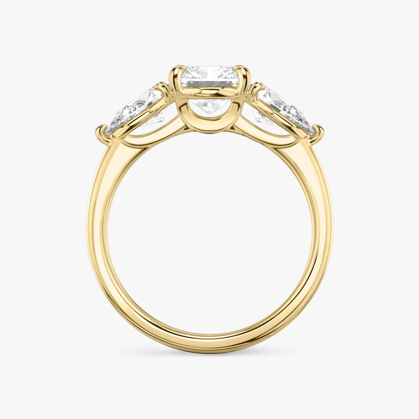 The Three Stone | Radiant | 18k | 18k Yellow Gold | Band: Plain | Side stone carat: 1/2 | Side stone shape: Pear | Diamond orientation: vertical | Carat weight: See full inventory