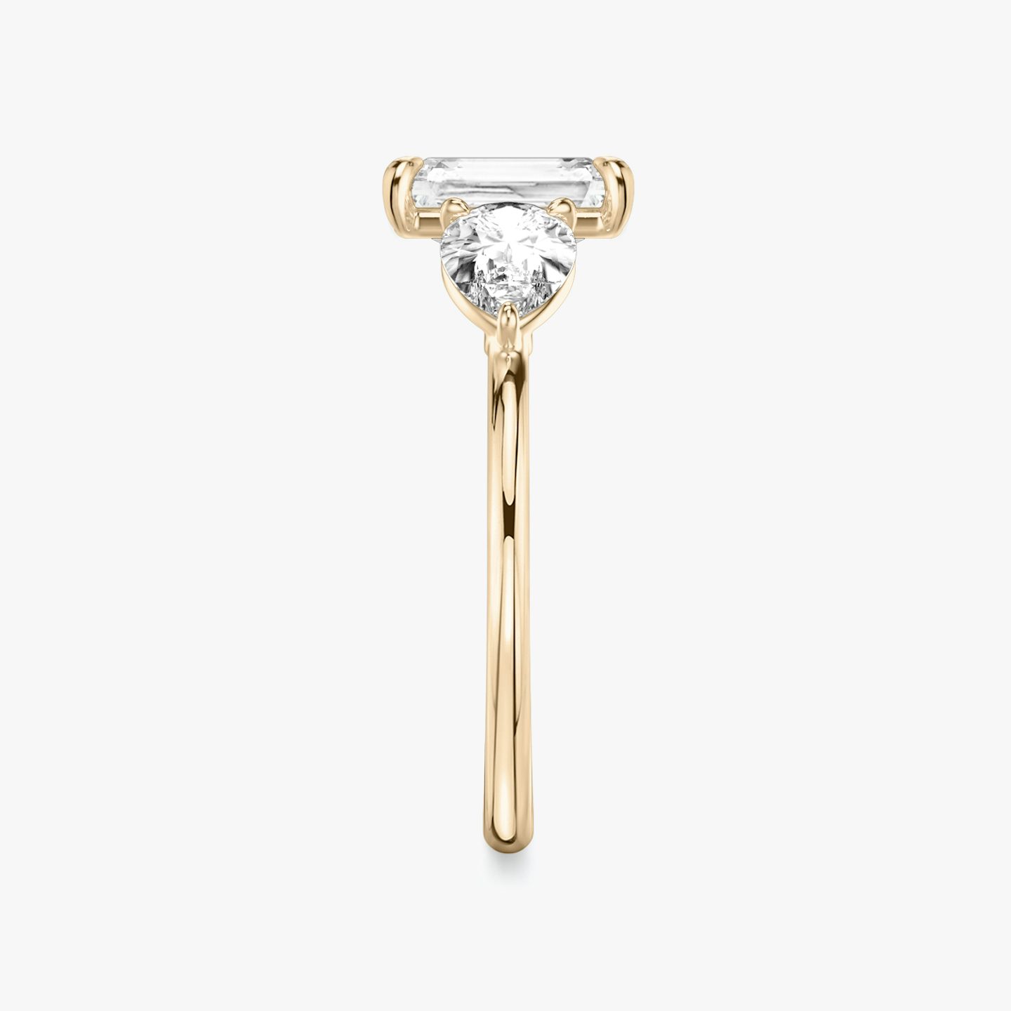 The Three Stone | Radiant | 14k | 14k Rose Gold | Band: Plain | Side stone carat: 1/2 | Side stone shape: Pear | Diamond orientation: vertical | Carat weight: See full inventory