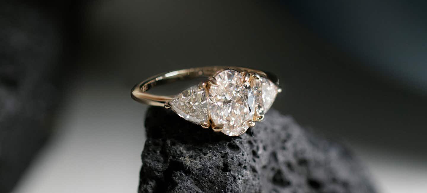 Oval Three Stone Engagement Ring with Trillion side stones