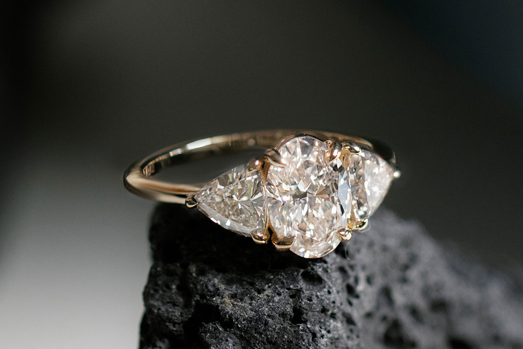 Oval Three Stone Engagement Ring with Trillion side stones