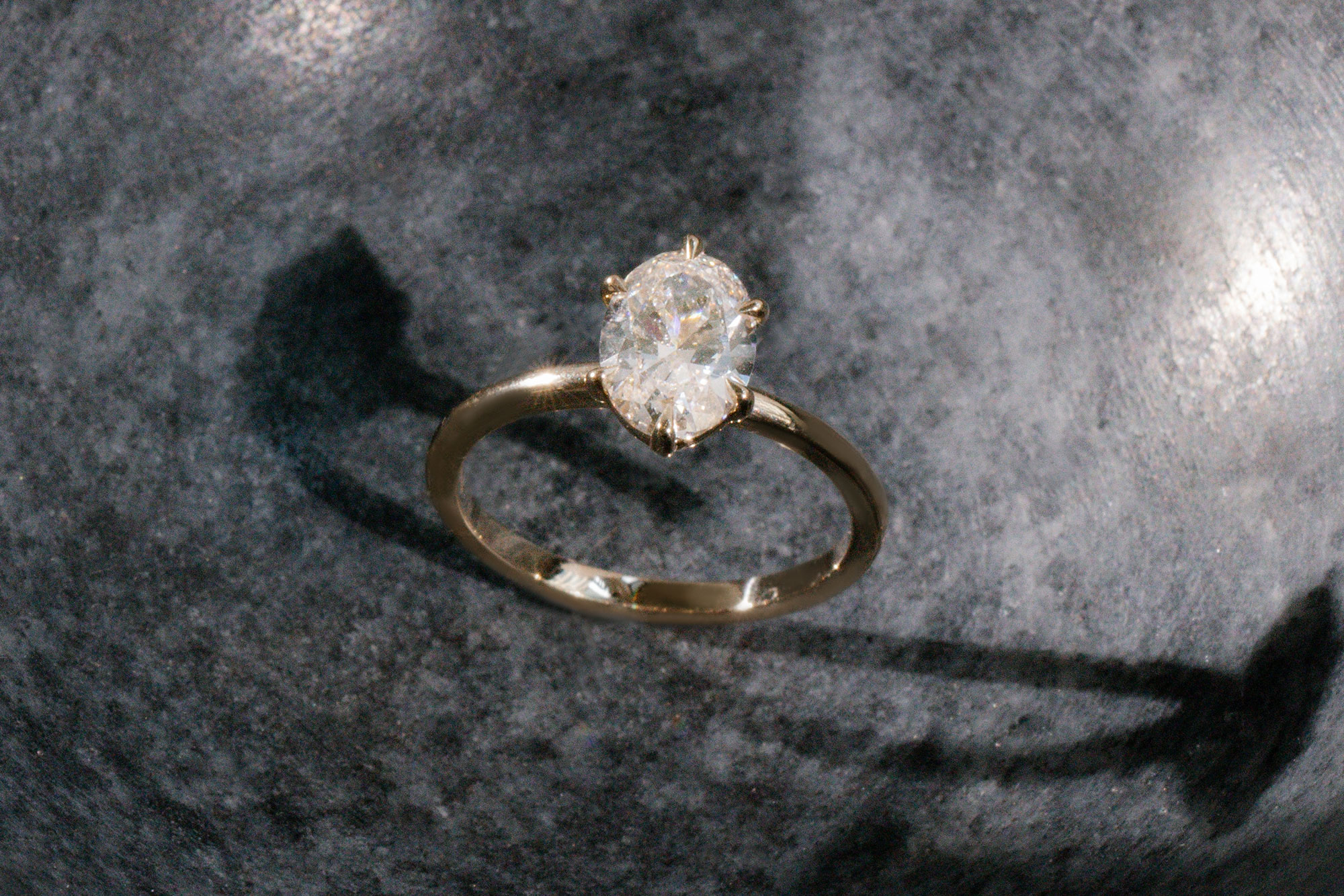 The oval signature 6 prong with yellow gold band