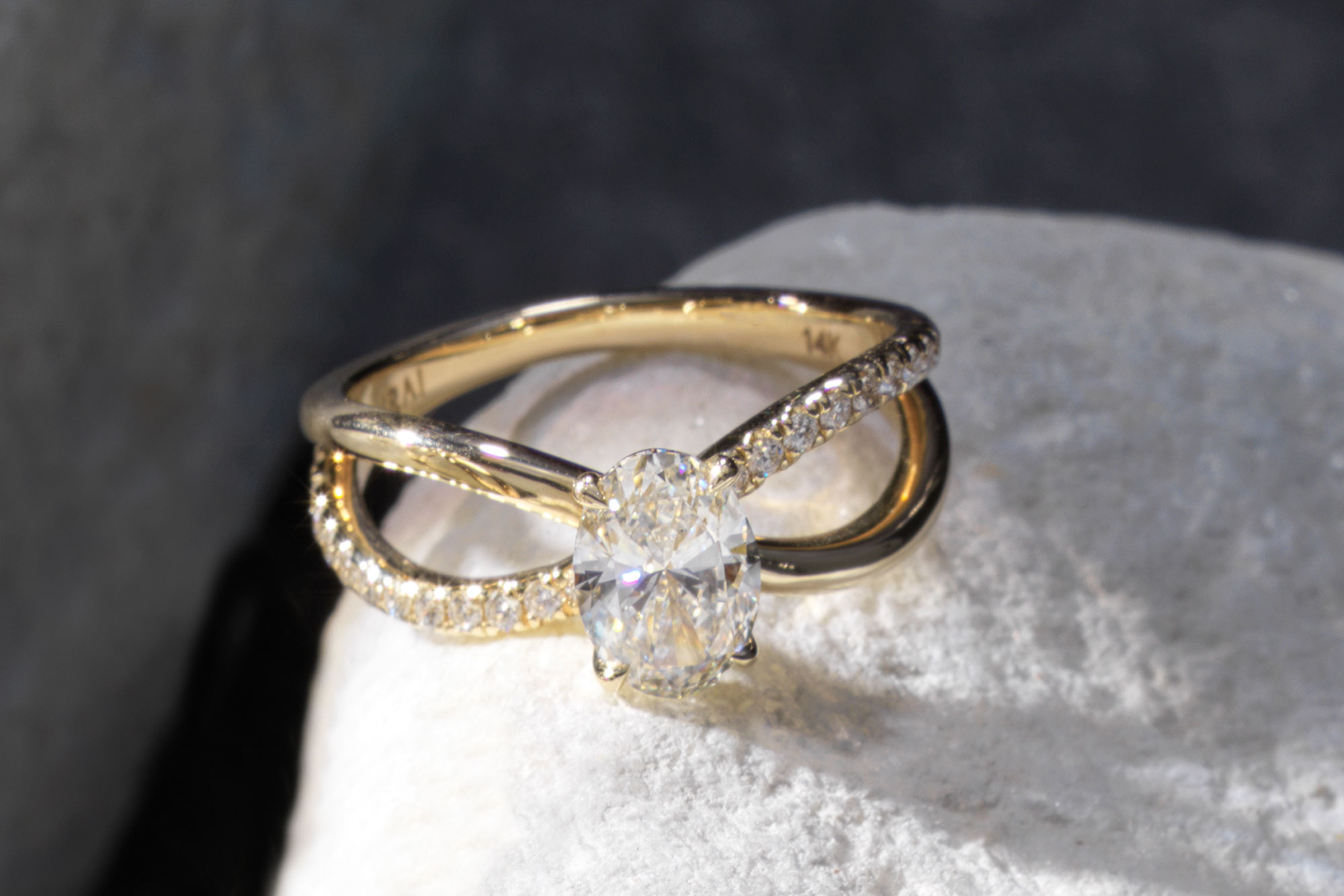 The oval duet engagement ring with yellow gold pave band