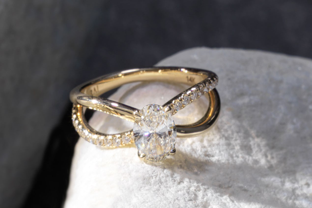 The oval duet engagement ring with yellow gold pave band 