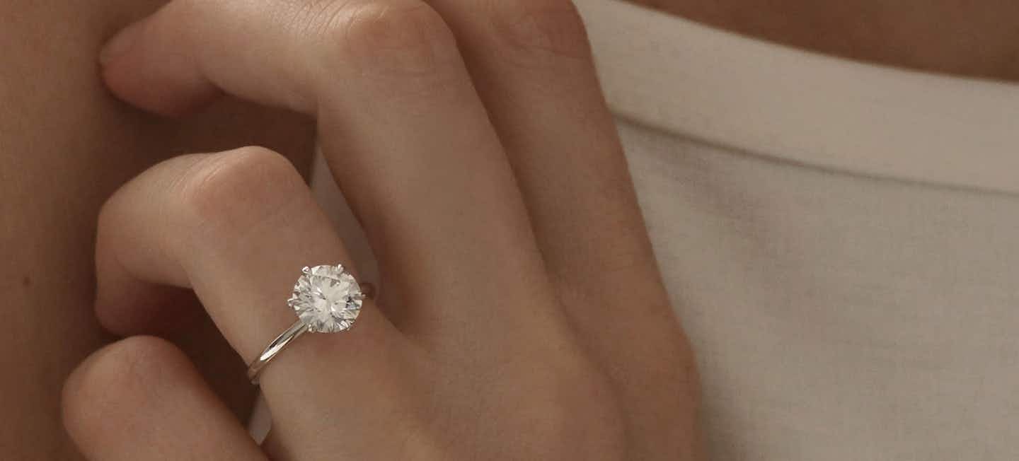 round brilliant signature solitaire white gold engagement ring