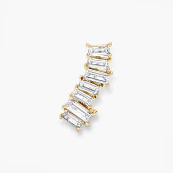 Ear arc made aout of solid yellow gold and 7 baguette shaped diamonds