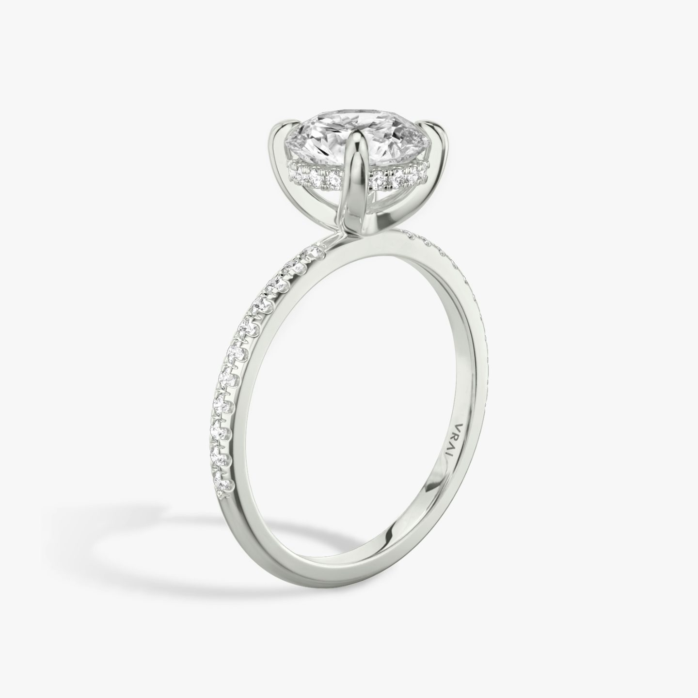 The Classic Hidden Halo | Round Brilliant | Platinum | Band: Pavé | Carat weight: See full inventory | Prong style: Plain | Diamond orientation: vertical
