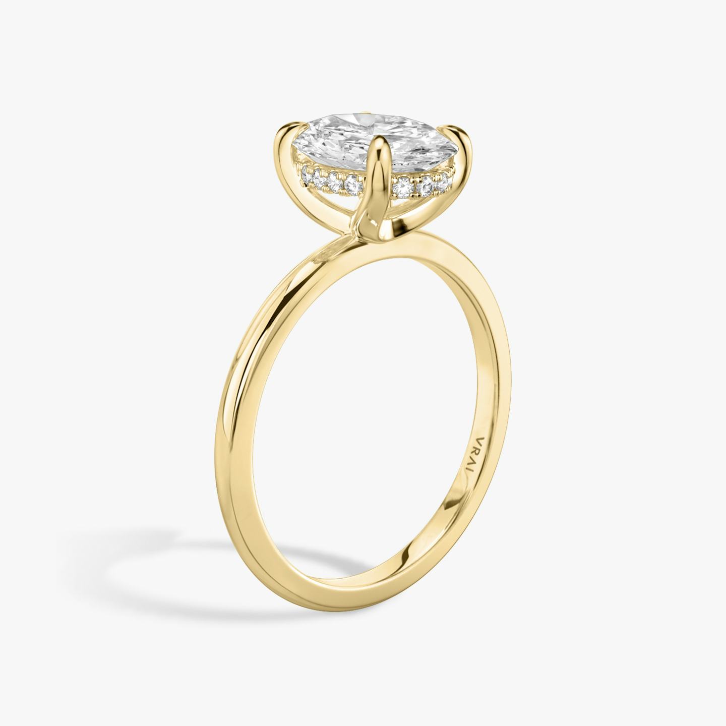 Hidden Halo oval yellow gold engagement ring