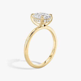 Hidden Halo oval yellow gold engagement ring