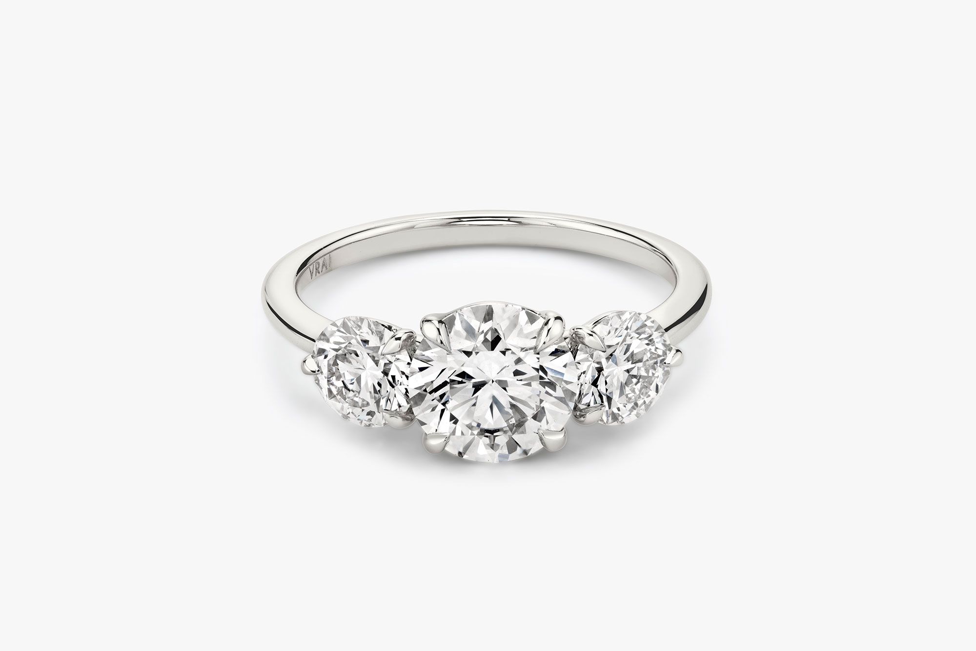The Three Stone ring in platinum with a round brilliant cut diamond