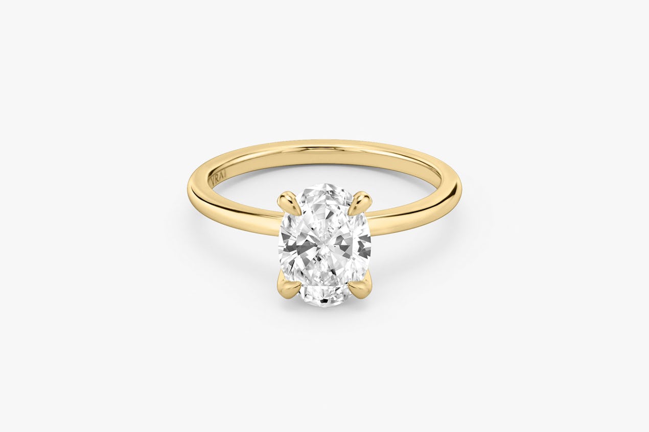 The Classic solitaire in 18k yellow gold with an oval cut diamond