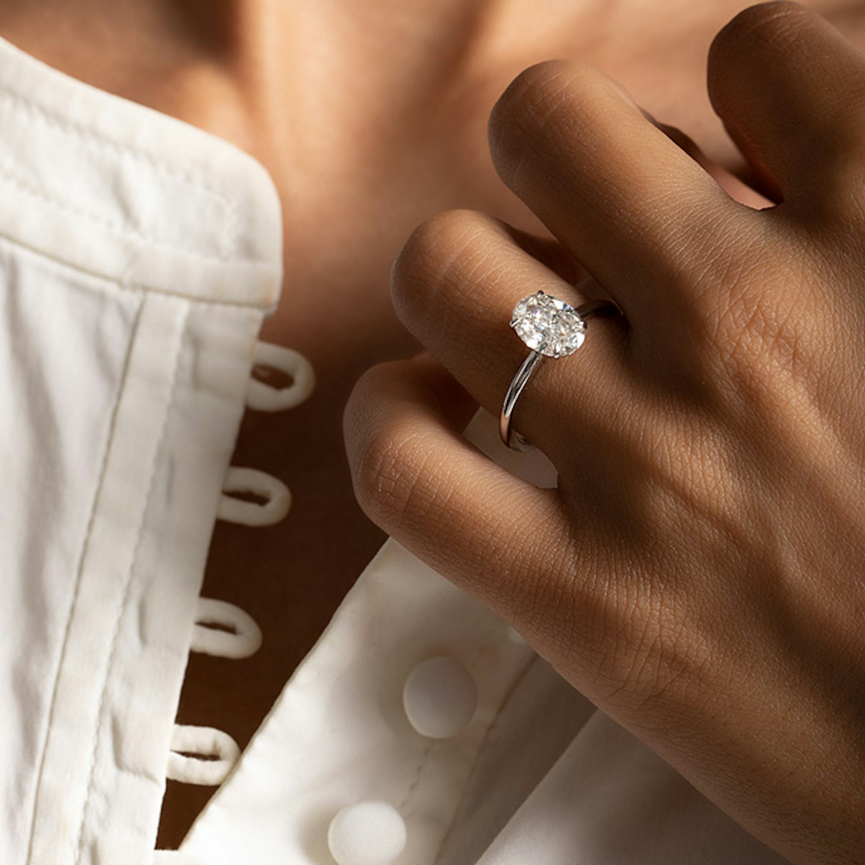 Oval diamond in a platinum ring Clearance