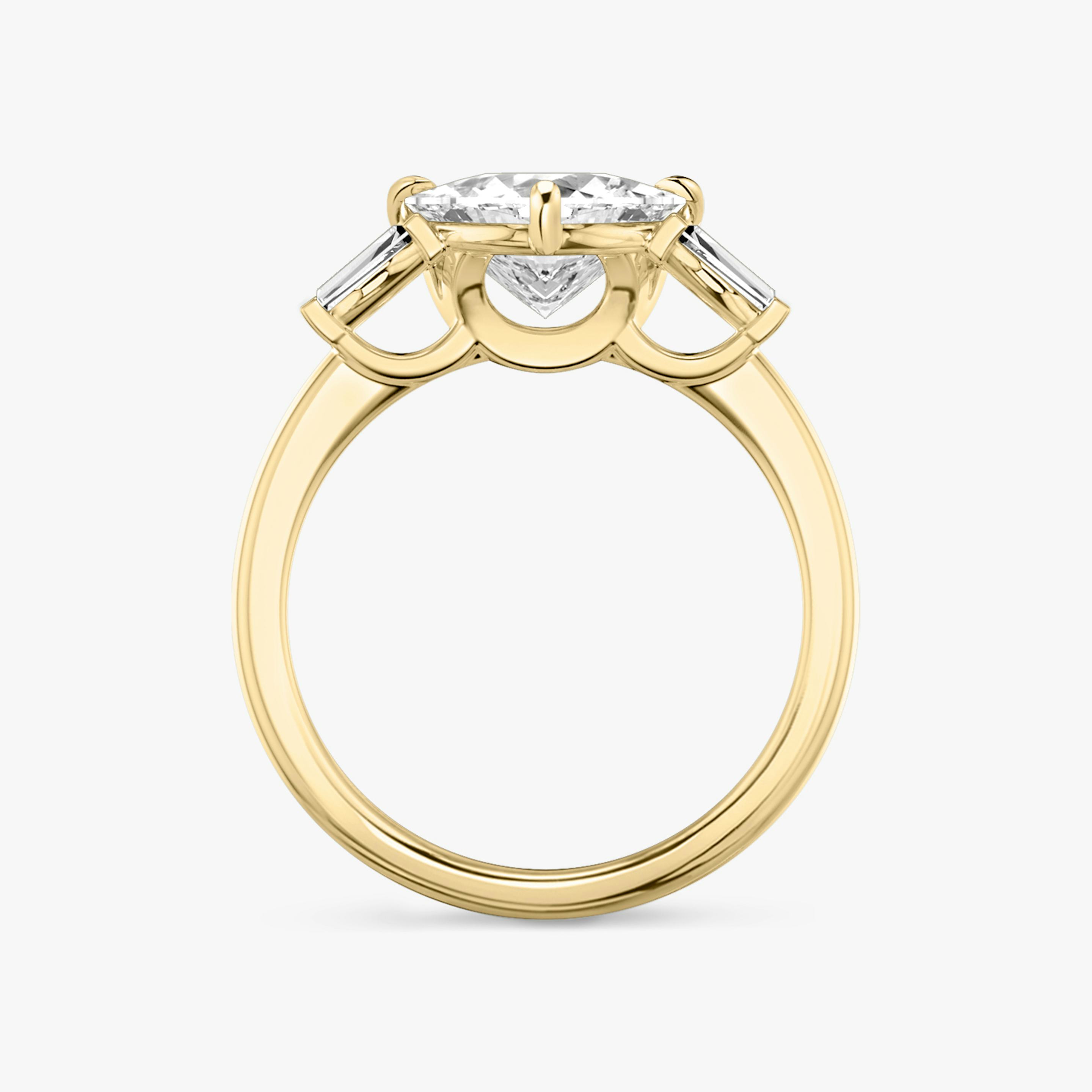 The Three Stone | Trillion | 18k | 18k Yellow Gold | Band: Plain | Side stone carat: 1/10 | Side stone shape: Tapered Baguette | Diamond orientation: vertical | Carat weight: See full inventory
