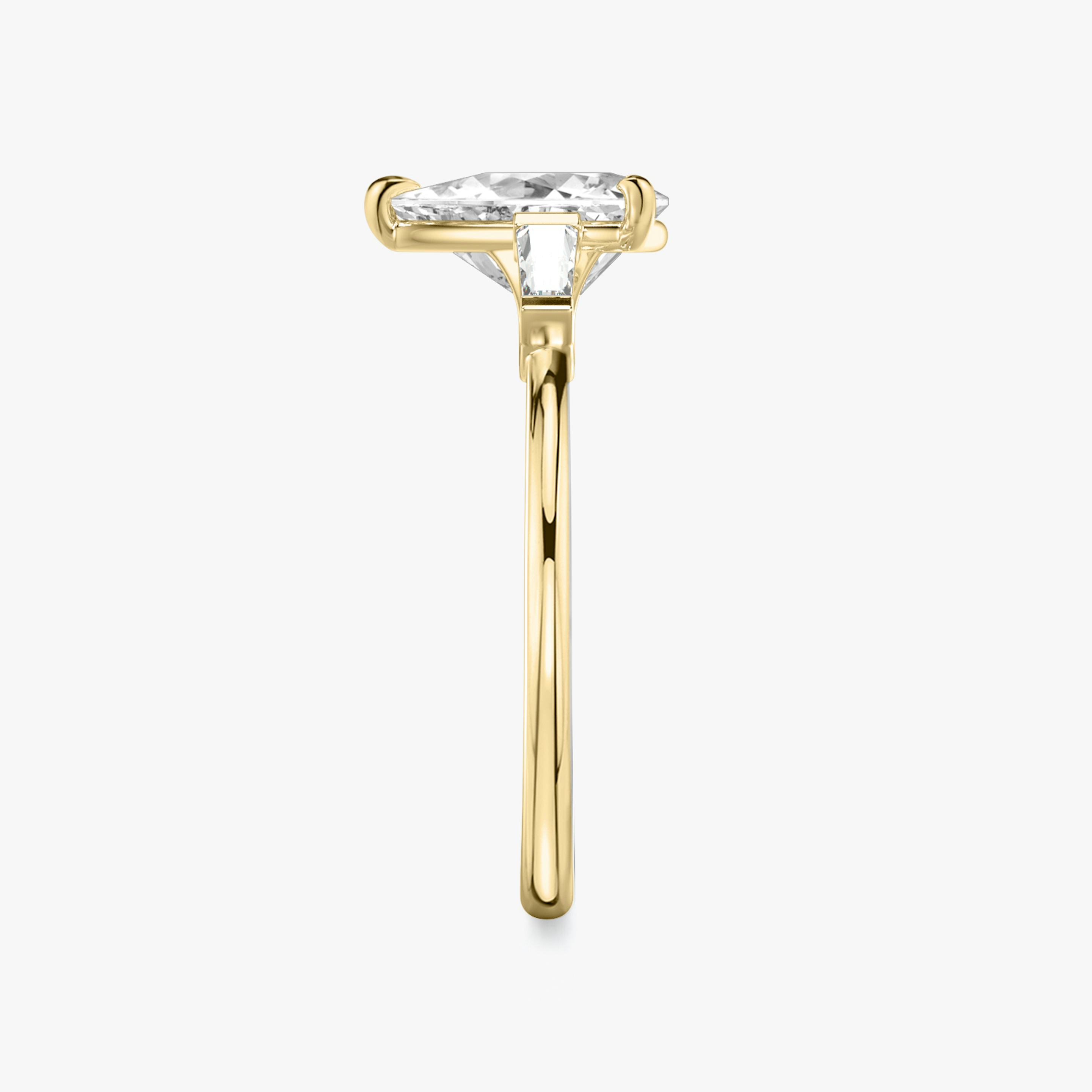 The Three Stone | Trillion | 18k | 18k Yellow Gold | Band: Plain | Side stone carat: 1/10 | Side stone shape: Tapered Baguette | Diamond orientation: vertical | Carat weight: See full inventory