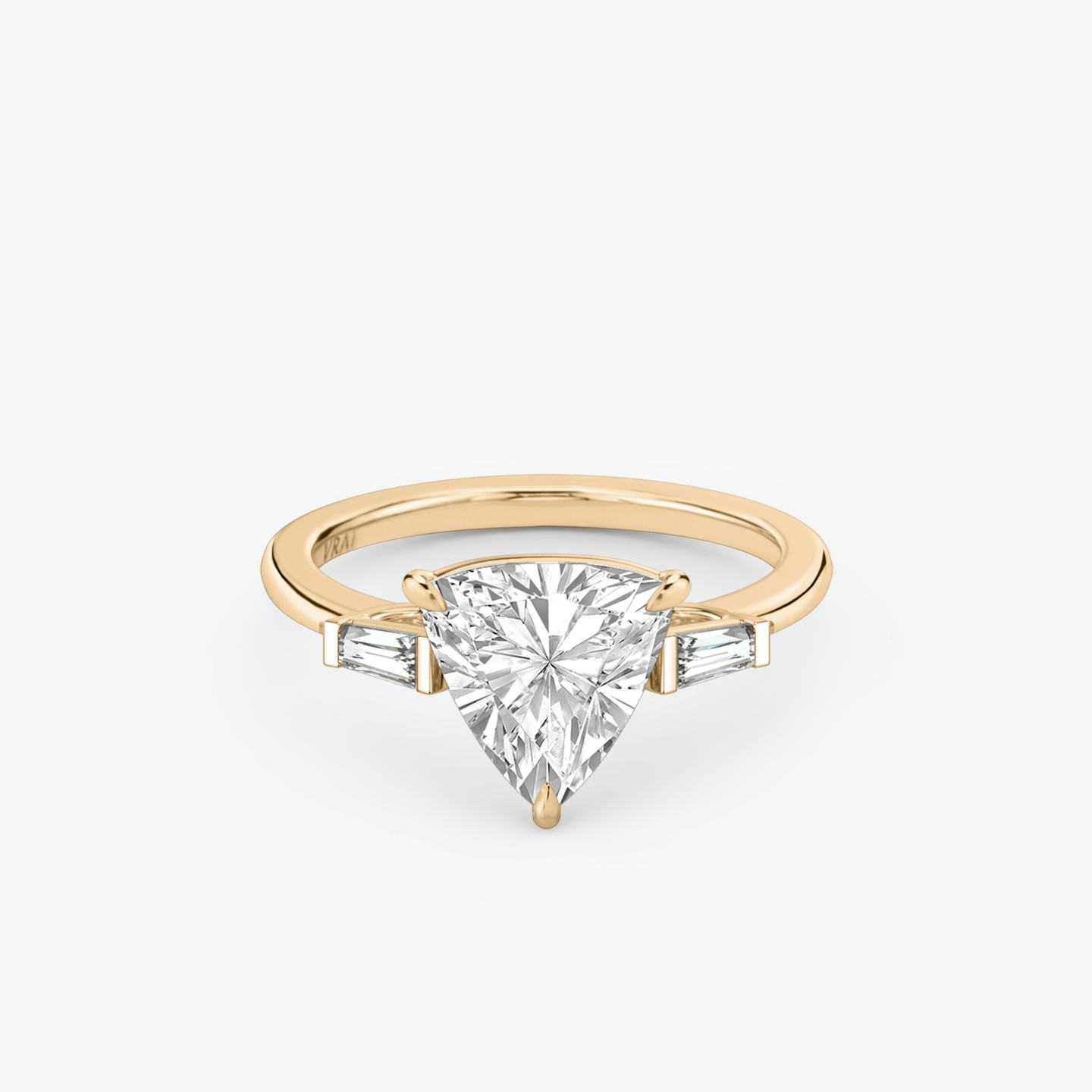The Three Stone | Trillion | 14k | 14k Rose Gold | Band: Plain | Side stone carat: 1/10 | Side stone shape: Tapered Baguette | Diamond orientation: vertical | Carat weight: See full inventory