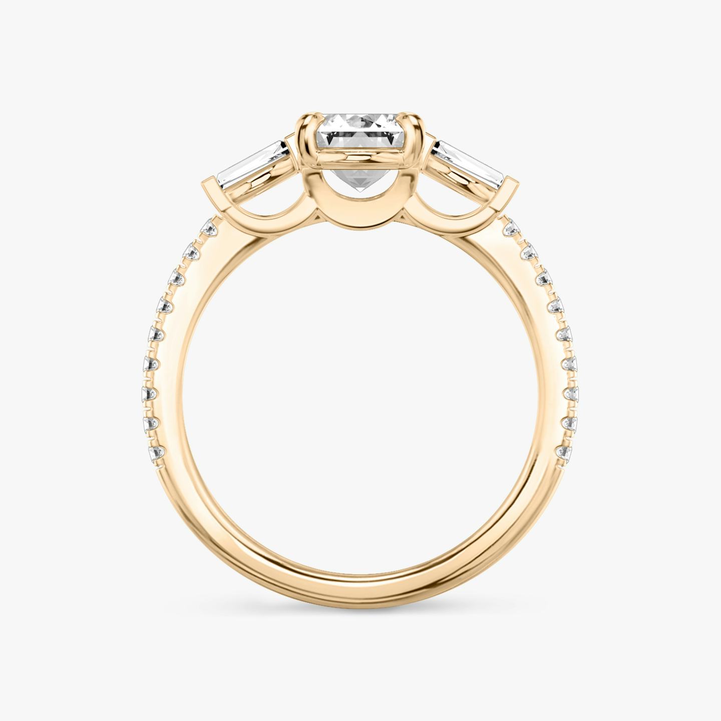 The Three Stone | Emerald | 14k | 14k Rose Gold | Band: Pavé | Side stone carat: 1/10 | Side stone shape: Tapered Baguette | Diamond orientation: vertical | Carat weight: See full inventory