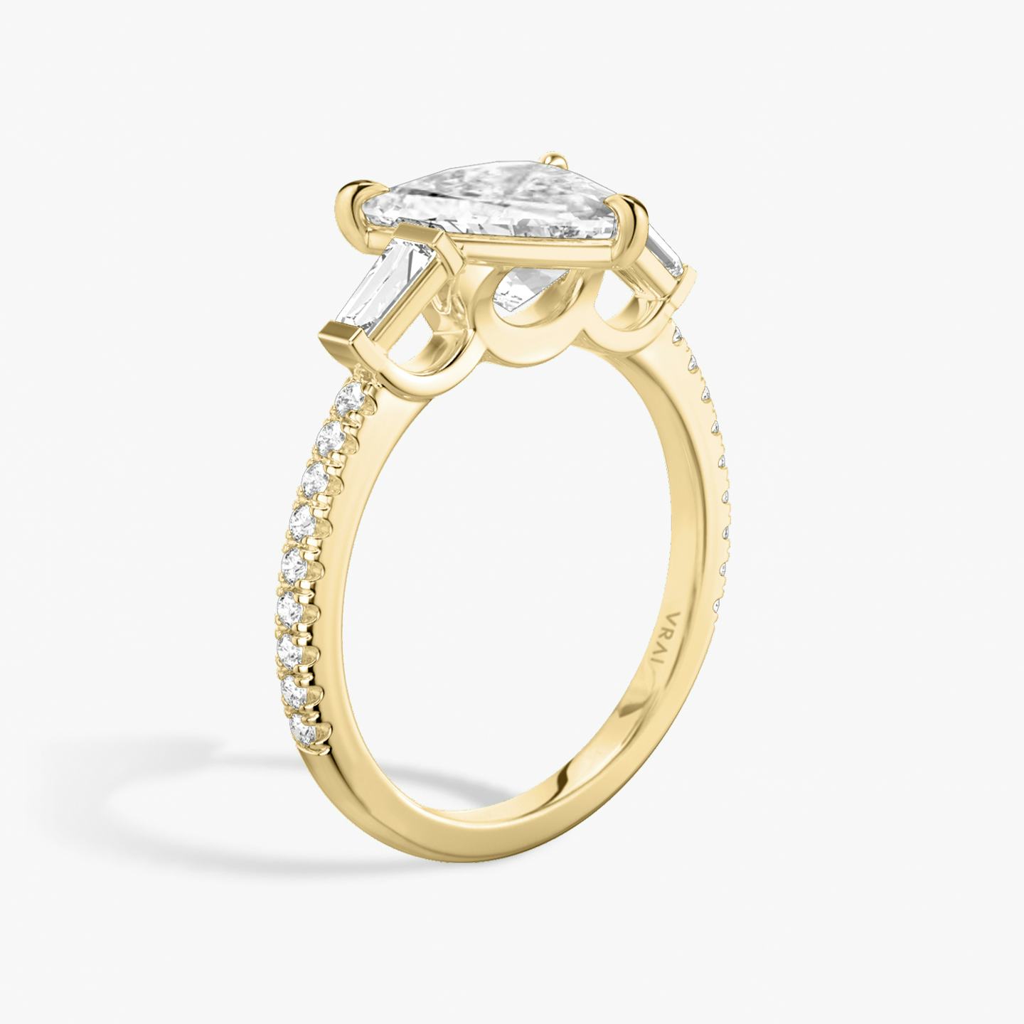 The Three Stone | Trillion | 18k | 18k Yellow Gold | Band: Pavé | Side stone carat: 1/10 | Side stone shape: Tapered Baguette | Diamond orientation: vertical | Carat weight: See full inventory