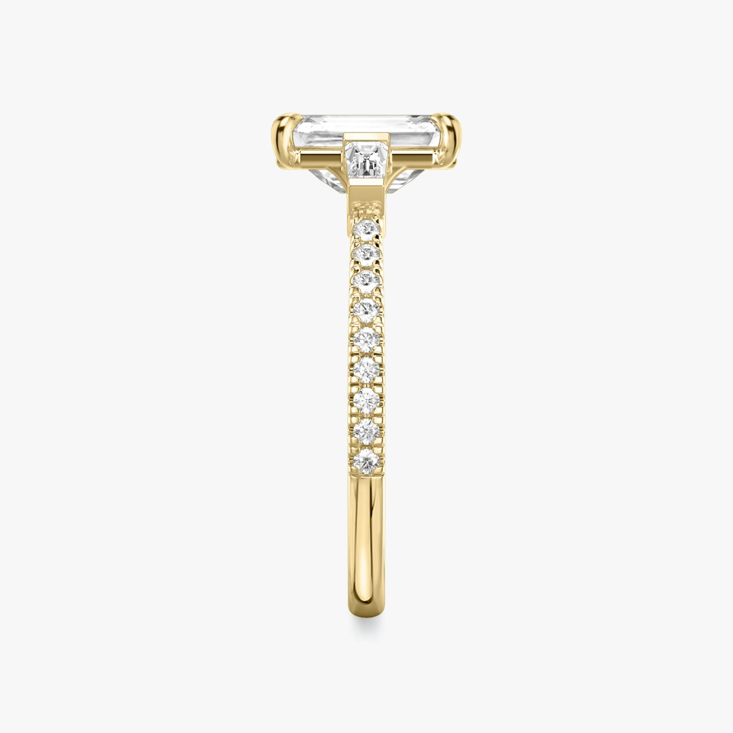 The Three Stone | Emerald | 18k | 18k Yellow Gold | Band: Pavé | Side stone carat: 1/10 | Side stone shape: Tapered Baguette | Diamond orientation: vertical | Carat weight: See full inventory