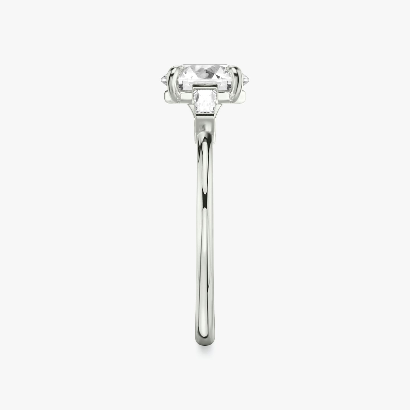 The Three Stone | Round Brilliant | 18k | 18k White Gold | Band: Plain | Carat weight: See full inventory | Side stone carat: 1/10 | Side stone shape: Tapered Baguette | Diamond orientation: vertical
