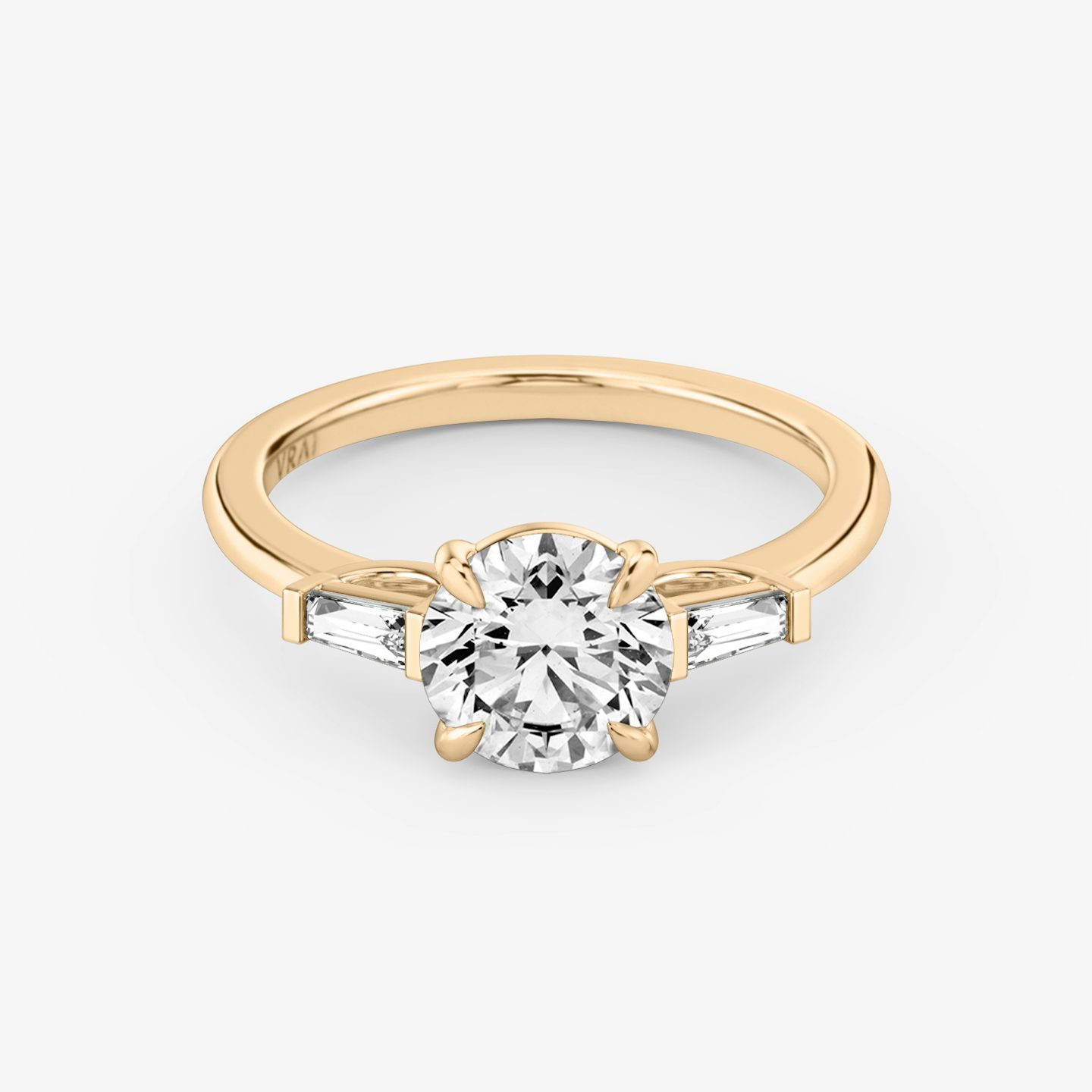 The Three Stone | Round Brilliant | 14k | 14k Rose Gold | Band: Plain | Carat weight: 2 | Side stone carat: 1/10 | Side stone shape: Tapered Baguette | Diamond orientation: vertical