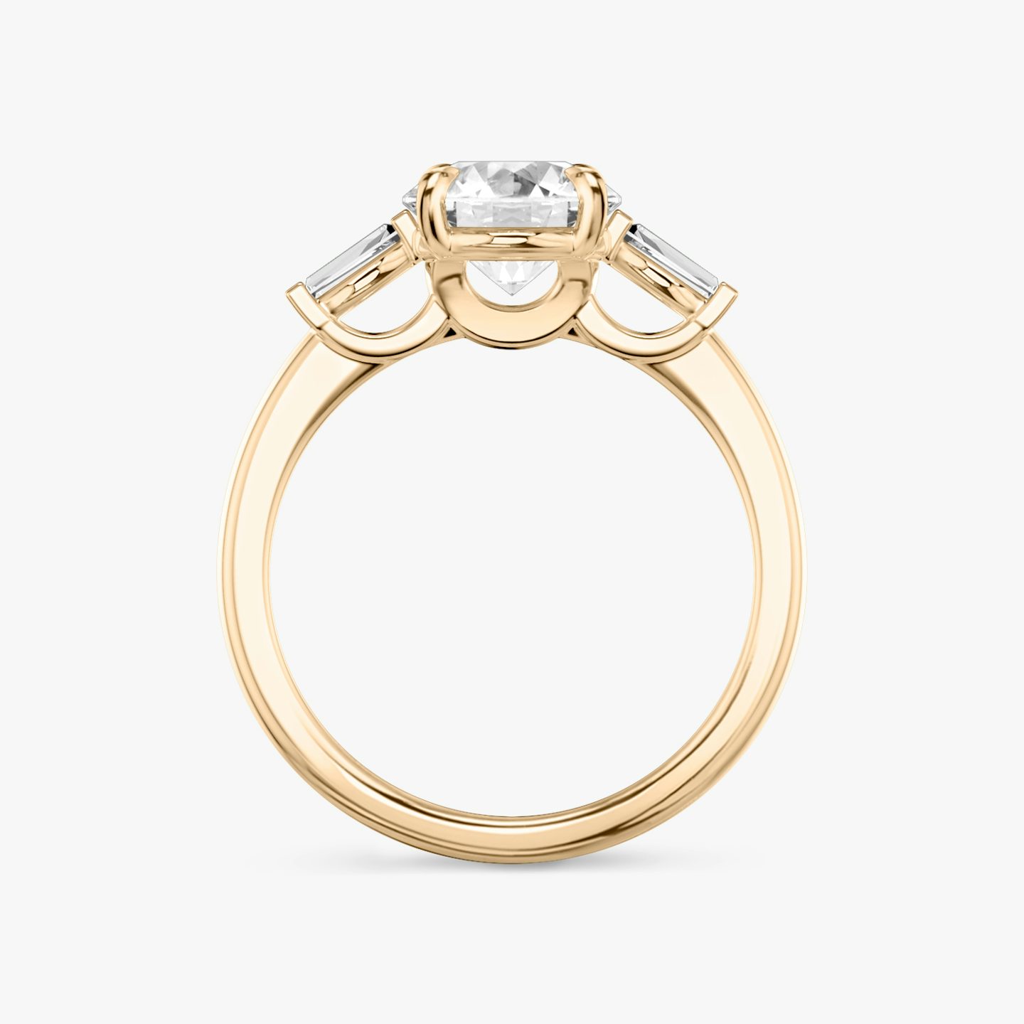 The Three Stone | Round Brilliant | 14k | 14k Rose Gold | Band: Plain | Carat weight: See full inventory | Side stone carat: 1/10 | Side stone shape: Tapered Baguette | Diamond orientation: vertical
