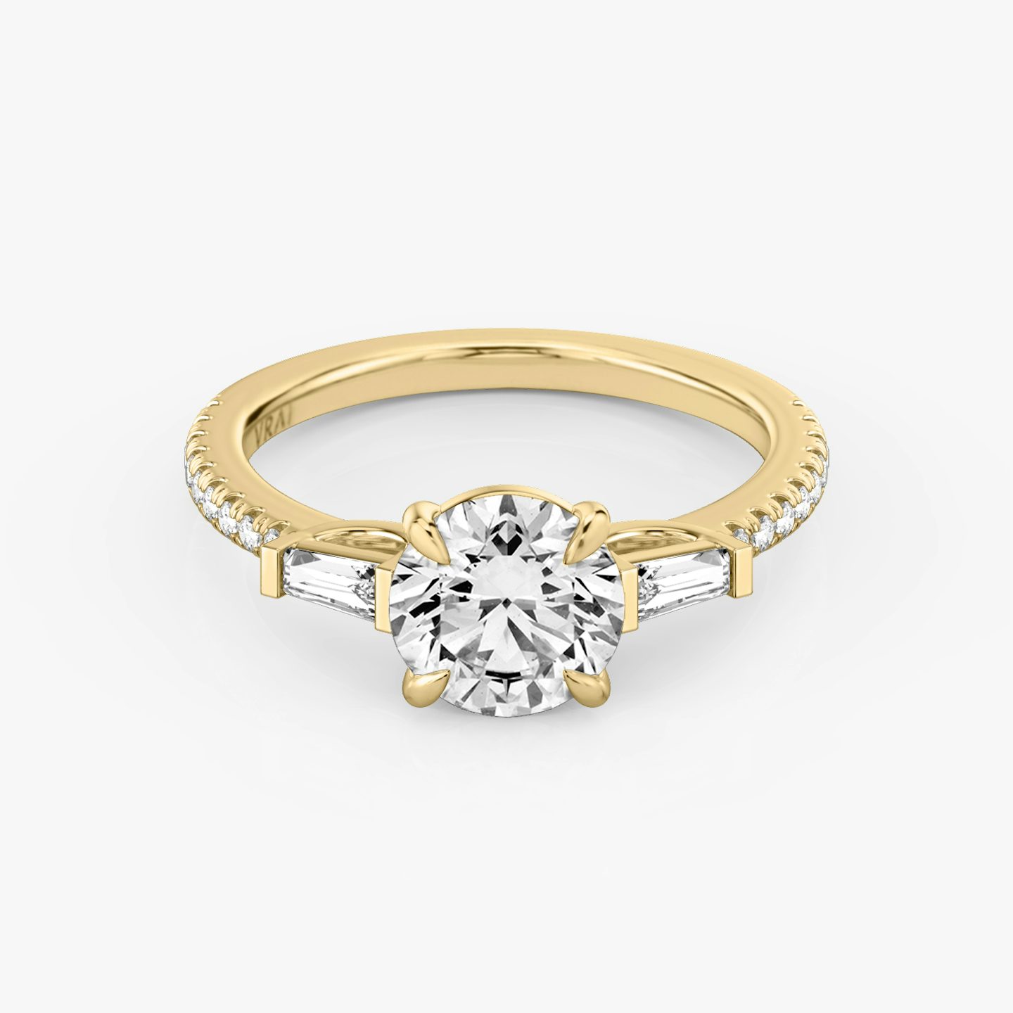 The Three Stone | Round Brilliant | 18k | 18k Yellow Gold | Band: Pavé | Carat weight: 1 | Side stone carat: 1/10 | Side stone shape: Tapered Baguette | Diamond orientation: vertical