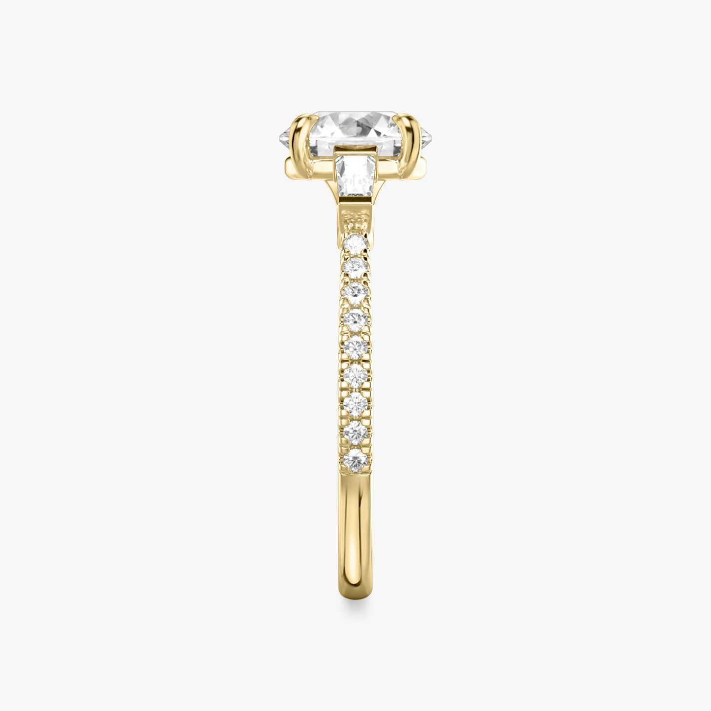 The Three Stone | Round Brilliant | 18k | 18k Yellow Gold | Band: Pavé | Carat weight: 1½ | Side stone carat: 1/10 | Side stone shape: Tapered Baguette | Diamond orientation: vertical