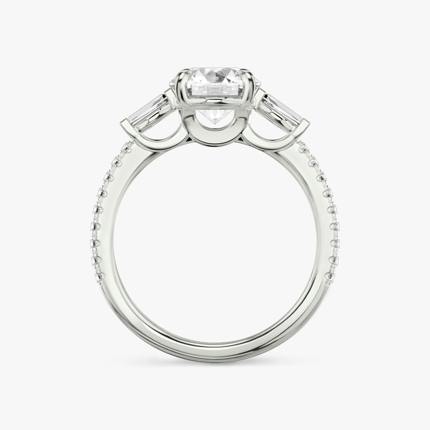 The Three Stone | Round Brilliant | 18k | 18k White Gold | Band: Pavé | Carat weight: 1 | Side stone carat: 1/10 | Side stone shape: Tapered Baguette | Diamond orientation: vertical