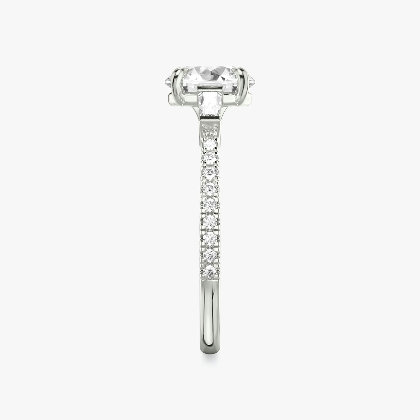 The Three Stone | Round Brilliant | Platinum | Band: Pavé | Carat weight: See full inventory | Side stone carat: 1/10 | Side stone shape: Tapered Baguette | Diamond orientation: vertical