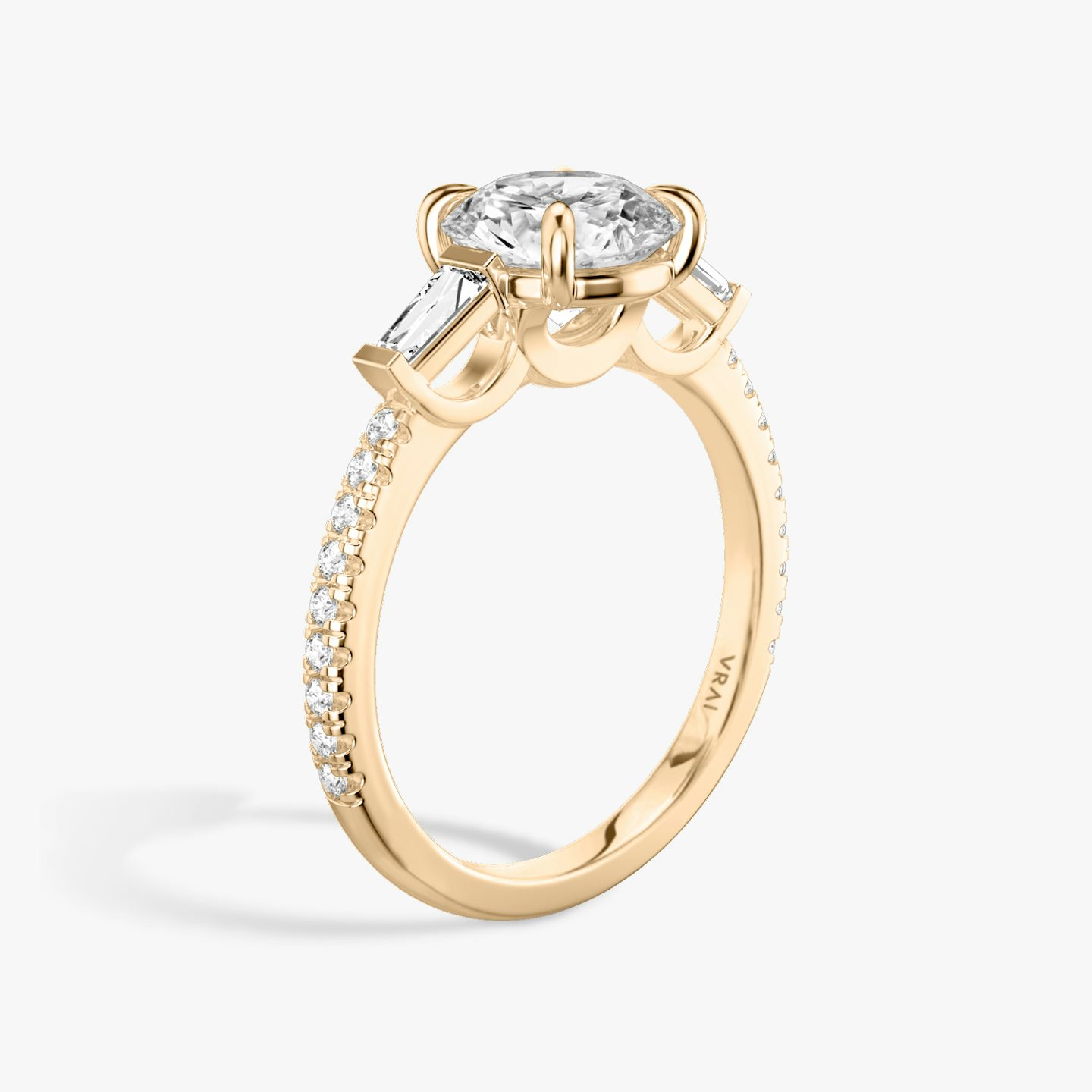 The Three Stone | Round Brilliant | 14k | 14k Rose Gold | Band: Pavé | Carat weight: 1 | Side stone carat: 1/10 | Side stone shape: Tapered Baguette | Diamond orientation: vertical