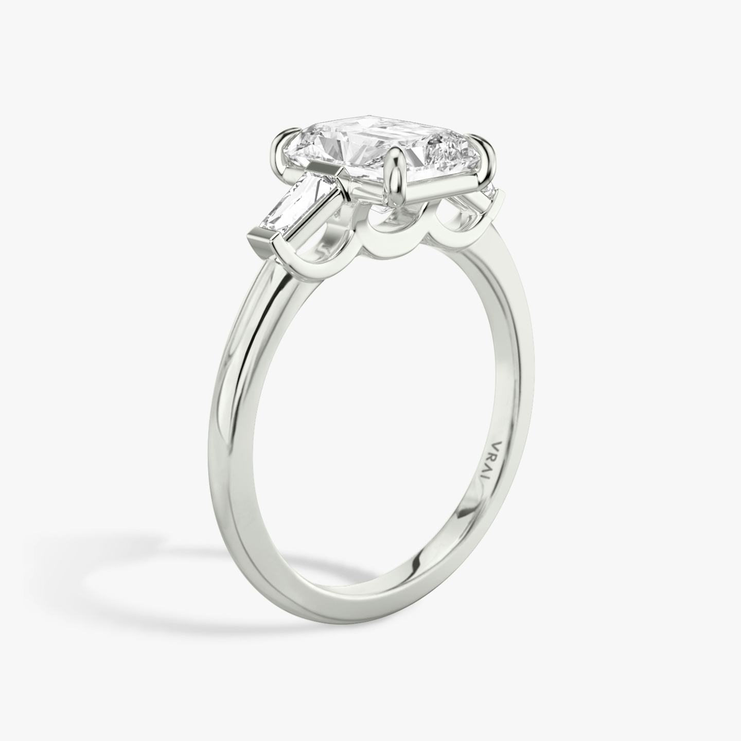 The Three Stone | Radiant | 18k | 18k White Gold | Band: Plain | Side stone carat: 1/10 | Side stone shape: Tapered Baguette | Diamond orientation: vertical | Carat weight: See full inventory