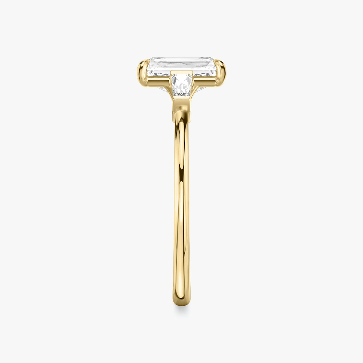 The Three Stone | Radiant | 18k | 18k Yellow Gold | Band: Plain | Side stone carat: 1/10 | Side stone shape: Tapered Baguette | Diamond orientation: vertical | Carat weight: See full inventory