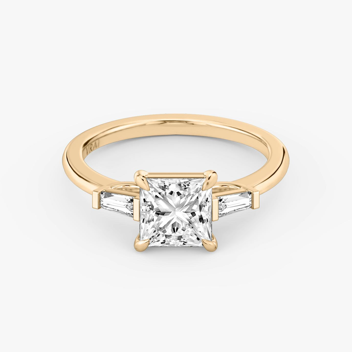 The Three Stone | Princess | 14k | 14k Rose Gold | Band: Plain | Side stone carat: 1/10 | Side stone shape: Tapered Baguette | Diamond orientation: vertical | Carat weight: See full inventory