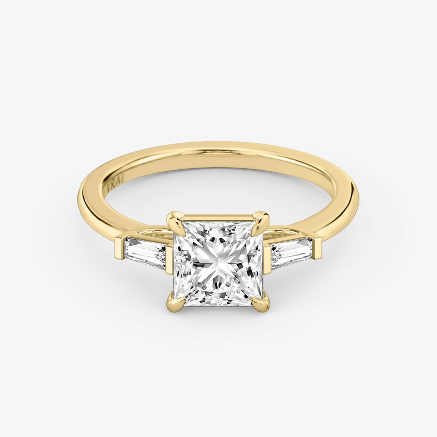 The Three Stone | Princess | 18k | 18k Yellow Gold | Band: Plain | Side stone carat: 1/10 | Side stone shape: Tapered Baguette | Diamond orientation: vertical | Carat weight: See full inventory
