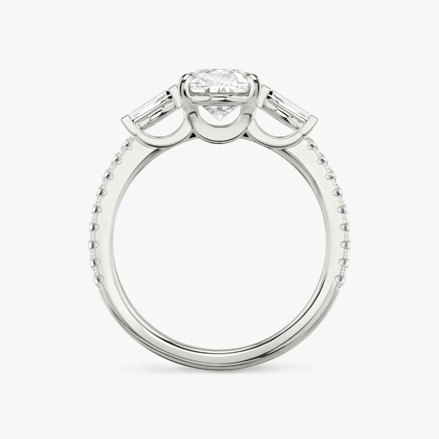 The Three Stone | Pear | Platinum | Band: Pavé | Side stone carat: 1/10 | Side stone shape: Tapered Baguette | Diamond orientation: vertical | Carat weight: See full inventory