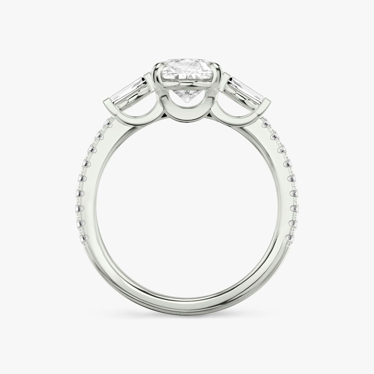 The Three Stone | Pear | 18k | 18k White Gold | Band: Pavé | Side stone carat: 1/10 | Side stone shape: Tapered Baguette | Diamond orientation: vertical | Carat weight: See full inventory