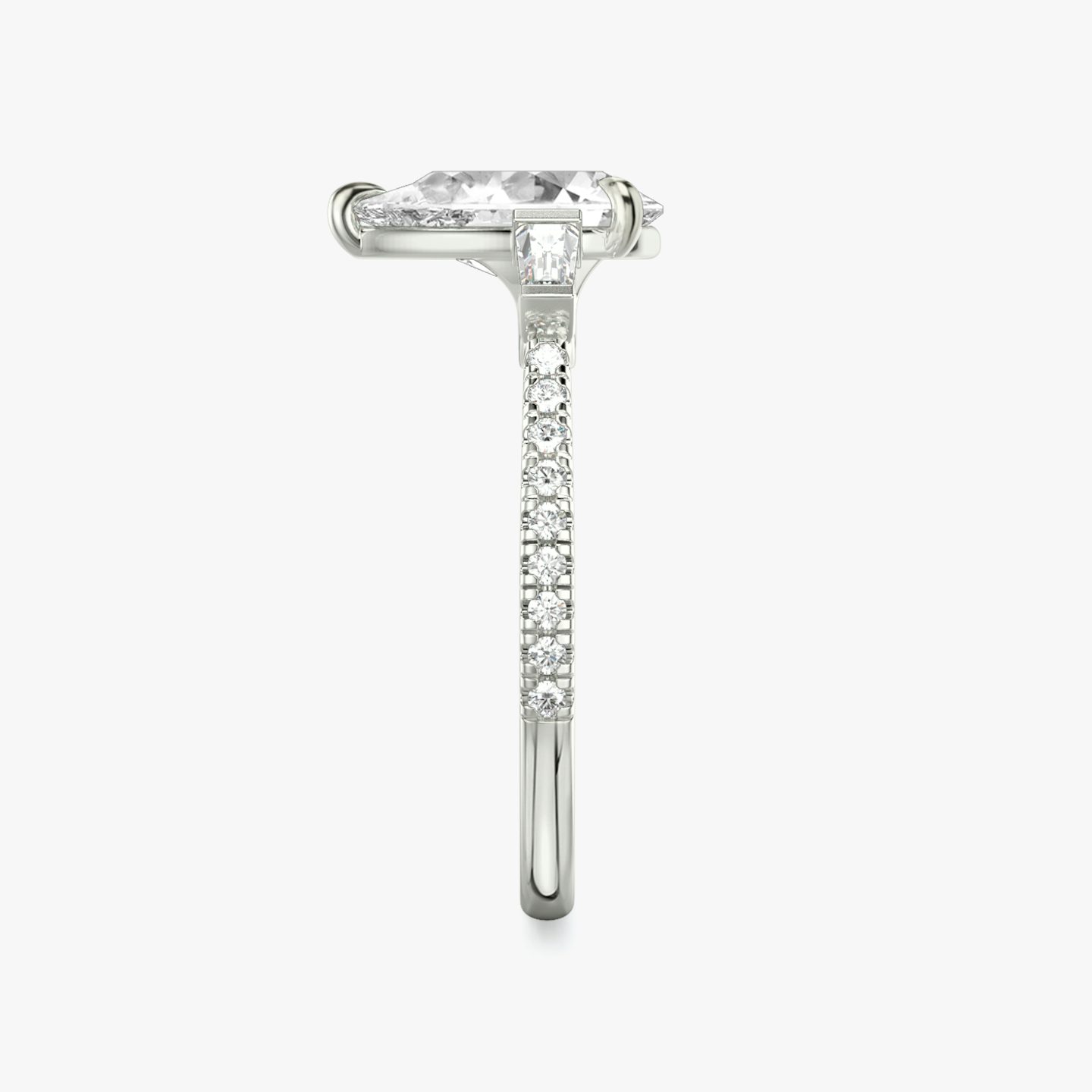 The Three Stone | Pear | 18k | 18k White Gold | Band: Pavé | Side stone carat: 1/10 | Side stone shape: Tapered Baguette | Diamond orientation: vertical | Carat weight: See full inventory