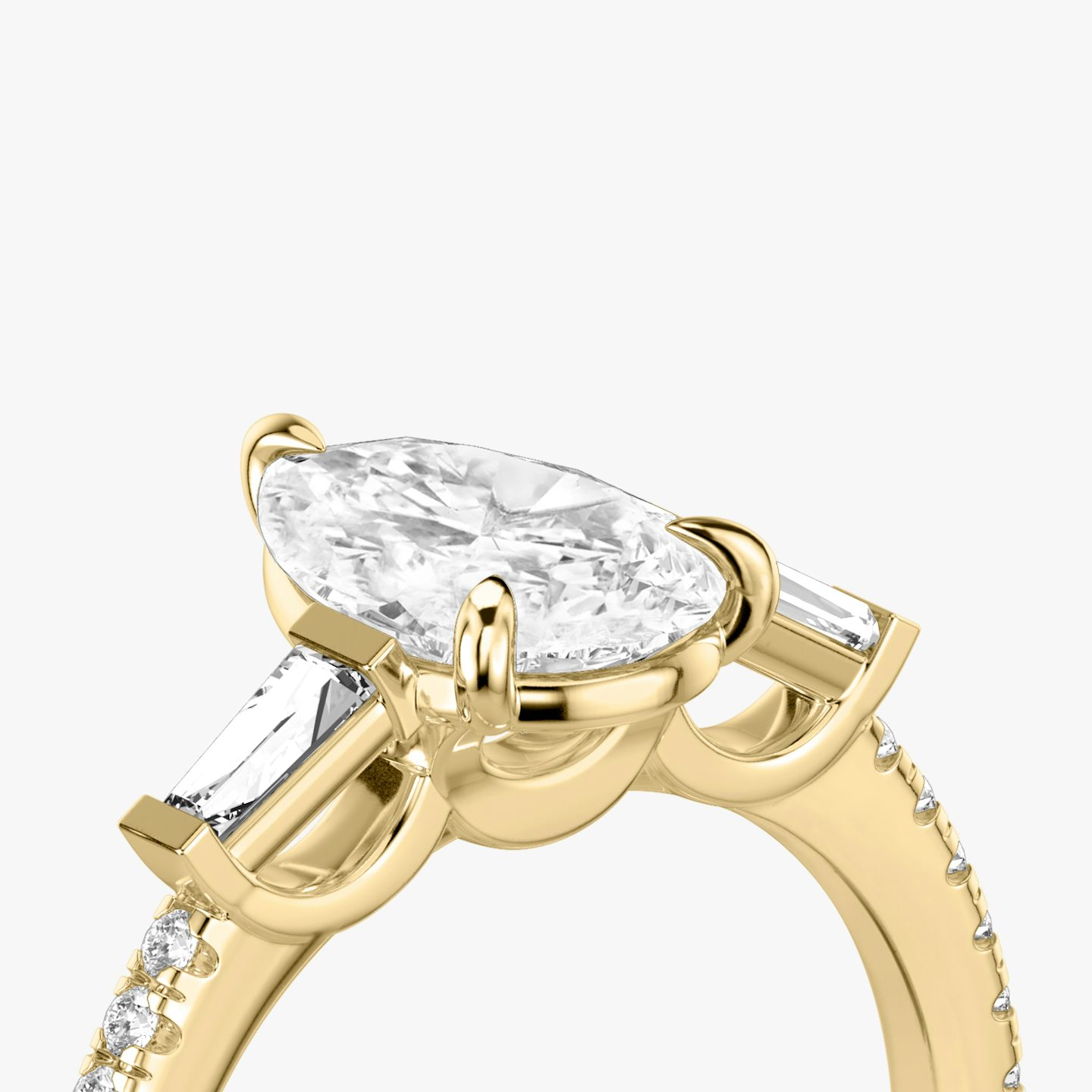 The Three Stone | Pear | 18k | 18k Yellow Gold | Band: Pavé | Side stone carat: 1/10 | Side stone shape: Tapered Baguette | Diamond orientation: vertical | Carat weight: See full inventory