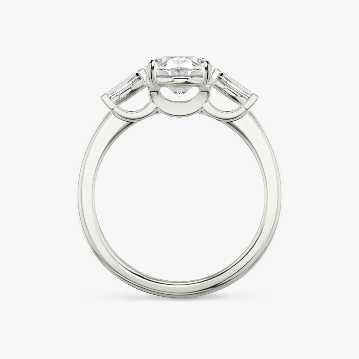 The Three Stone | Oval | 18k | 18k White Gold | Band: Plain | Side stone carat: 1/10 | Side stone shape: Tapered Baguette | Diamond orientation: vertical | Carat weight: See full inventory