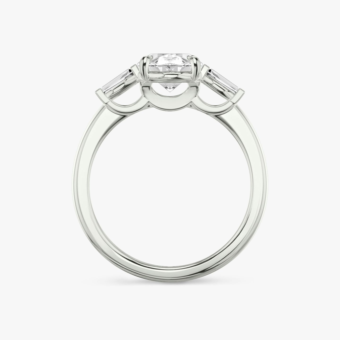 The Three Stone | Oval | 18k | 18k White Gold | Band: Plain | Side stone carat: 1/10 | Side stone shape: Tapered Baguette | Diamond orientation: vertical | Carat weight: See full inventory
