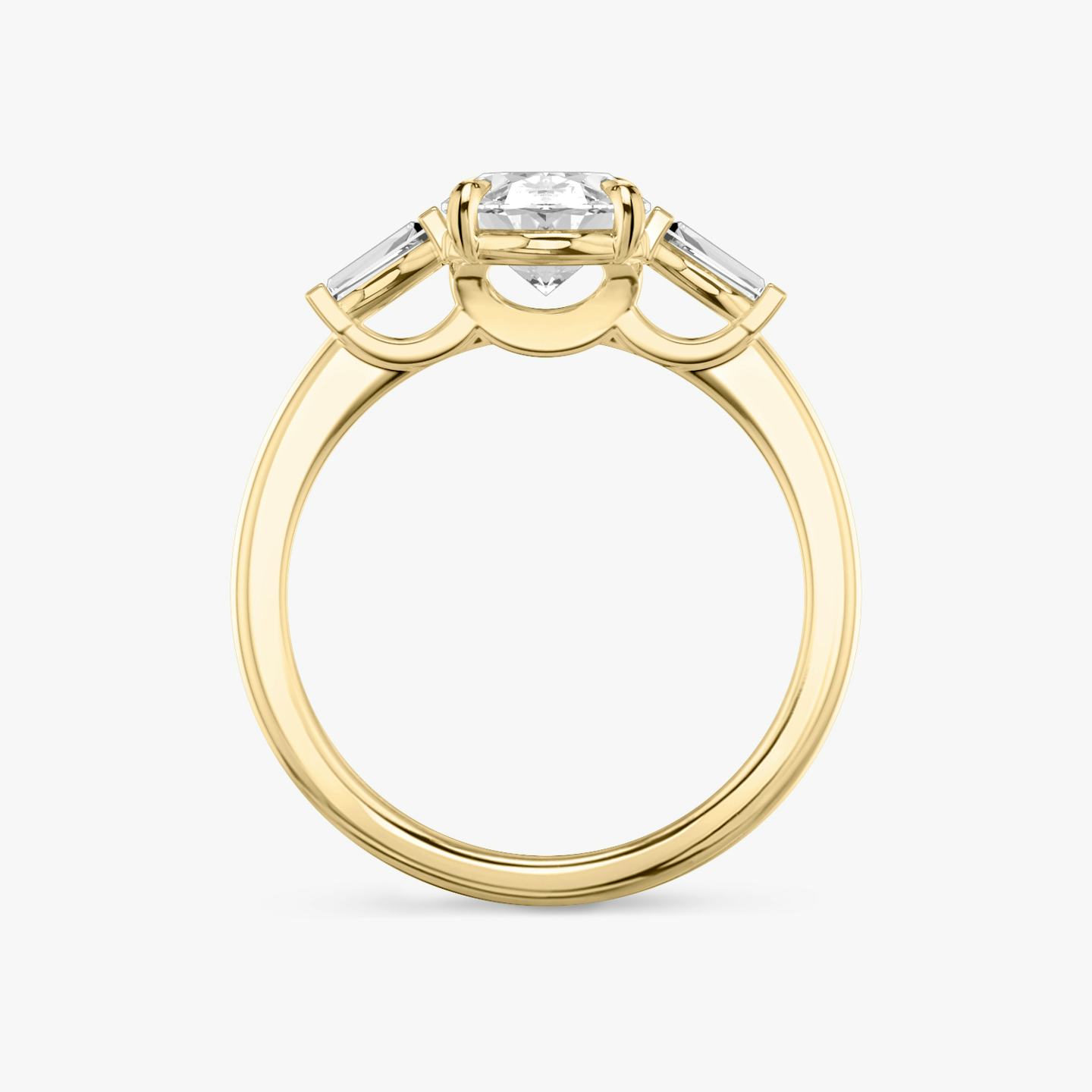 The Three Stone | Oval | 18k | 18k Yellow Gold | Band: Plain | Side stone carat: 1/10 | Side stone shape: Tapered Baguette | Diamond orientation: vertical | Carat weight: See full inventory
